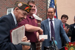 Previous VFW Post 2348 Commander, Mike Mehltretter, with Rocco Moretto and Councilmember Peter Vallone Jr., displaying the $5,000 check presented by Councilmember Peter Vallone Jr. to VFW Post 2348 in honor of Rocco Moretto.